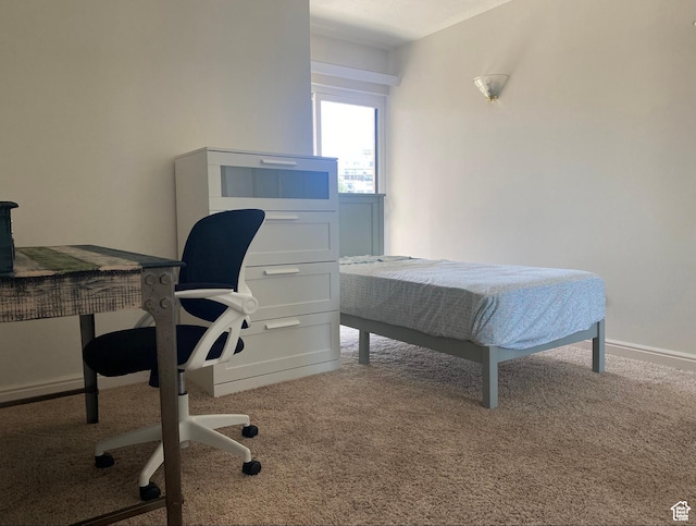 carpeted bedroom with baseboards