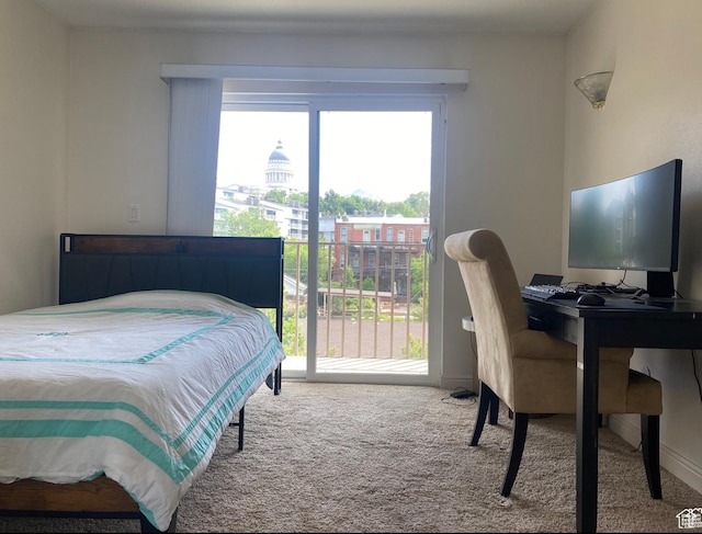 carpeted bedroom featuring access to outside