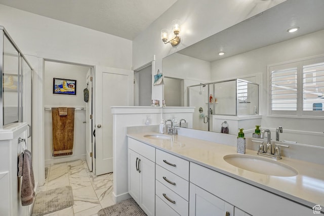 1002 E 2680 S, Heber City, UT 84032 - full bathroom featuring marble finish floor, double vanity, a stall shower, and a sink
