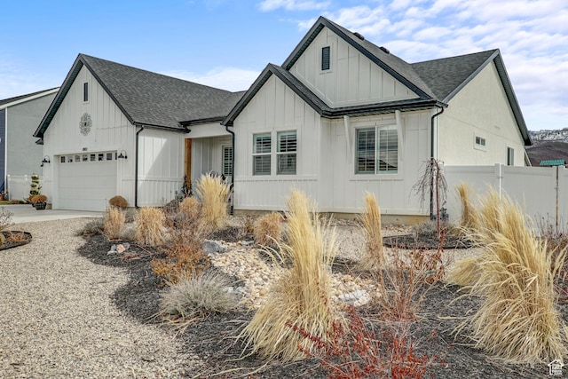 1002 E 2680 S, Heber City, UT 84032 - modern inspired farmhouse featuring an attached garage, fence, board and batten siding, and roof with shingles