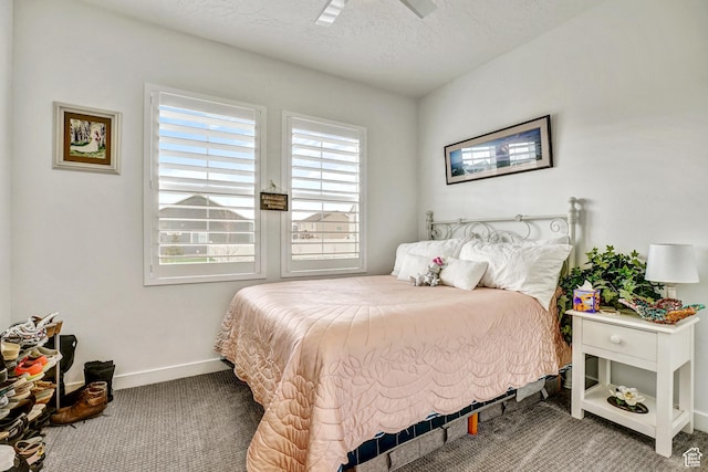 1002 E 2680 S, Heber City, UT 84032 - bedroom featuring baseboards, carpet flooring, a textured ceiling, and a ceiling fan