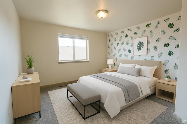 bedroom with carpet, baseboards, and wallpapered walls