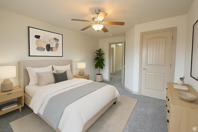 bedroom with carpet, baseboards, and ceiling fan