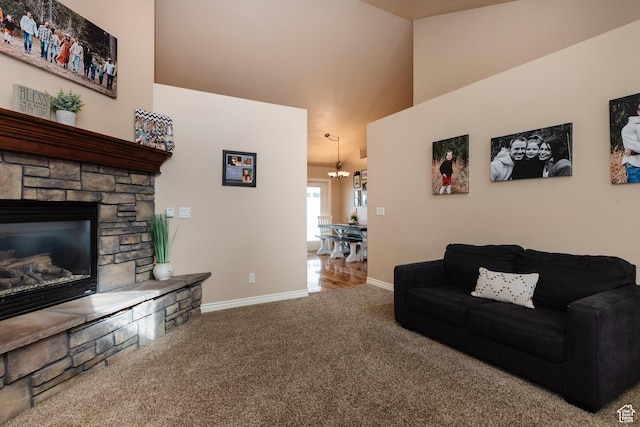787 S 2nd W, Preston, ID 83263 - carpeted living area featuring baseboards, a towering ceiling, an inviting chandelier, and a stone fireplace