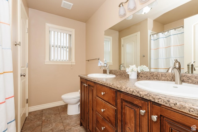 787 S 2nd W, Preston, ID 83263 - bathroom with double vanity, visible vents, toilet, and a sink