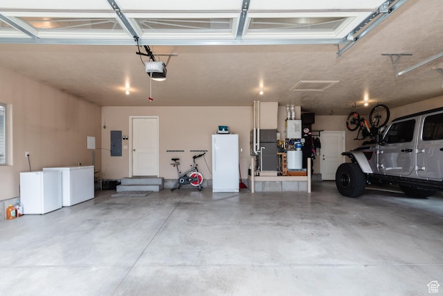 787 S 2nd W, Preston, ID 83263 - garage featuring electric panel, a garage door opener, and freestanding refrigerator