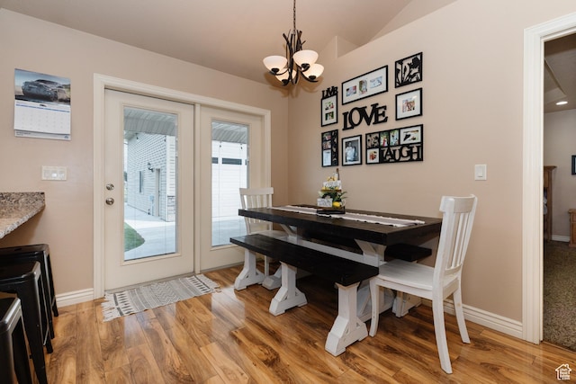 787 S 2nd W, Preston, ID 83263 - dining area with baseboards, vaulted ceiling, an inviting chandelier, and light wood-style floors