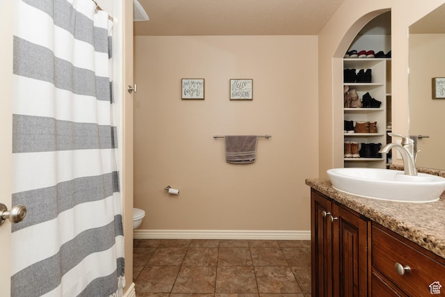 787 S 2nd W, Preston, ID 83263 - full bathroom featuring baseboards, toilet, and vanity