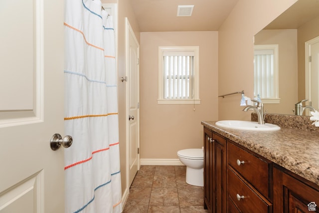 787 S 2nd W, Preston, ID 83263 - full bathroom featuring vanity, toilet, baseboards, visible vents, and curtained shower