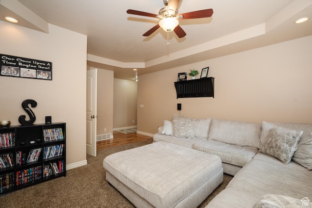 787 S 2nd W, Preston, ID 83263 - carpeted living room with a tray ceiling, recessed lighting, baseboards, visible vents, and a ceiling fan