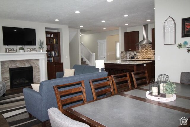 987 W 880 N, American Fork, UT 84003 - dining area with a high end fireplace, stairway, and recessed lighting