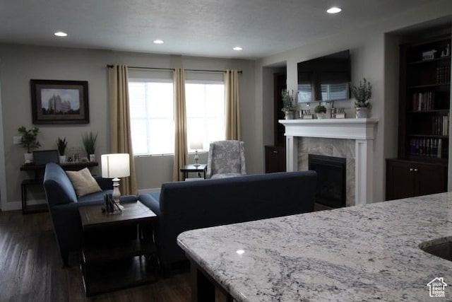 987 W 880 N, American Fork, UT 84003 - living room with recessed lighting, a tile fireplace, baseboards, and dark wood finished floors