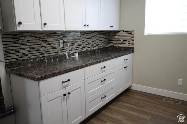 987 W 880 N, American Fork, UT 84003 - kitchen featuring dark stone countertops, white cabinetry, visible vents, and tasteful backsplash