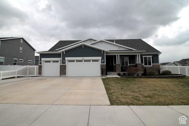 987 W 880 N, American Fork, UT 84003 - craftsman-style house with driveway, a garage, fence, and a front yard