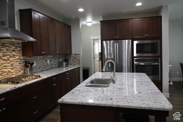 987 W 880 N, American Fork, UT 84003 - kitchen featuring dark wood-type flooring, decorative backsplash, a sink, wall chimney range hood, and appliances with stainless steel finishes
