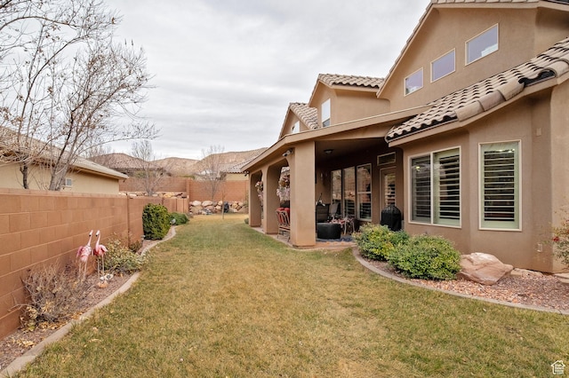 931 E Bramble Way, Washington, UT 84780 - view of yard featuring fence, a mountain view, and a patio