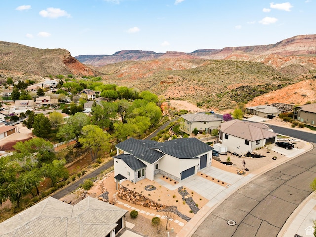 birds eye view of property featuring a mountain view