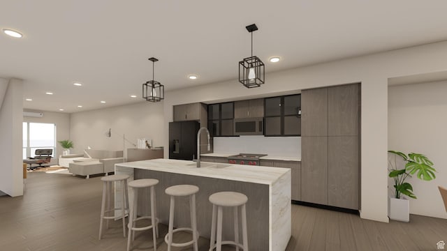 4350 S 900 E, Millcreek, UT 84124 - kitchen with light countertops, a breakfast bar, modern cabinets, stainless steel microwave, and a sink