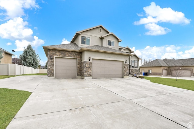 3182 N 1350 W, Pleasant View, UT 84414 - view of front of house featuring stucco siding, stone siding, concrete driveway, and a garage