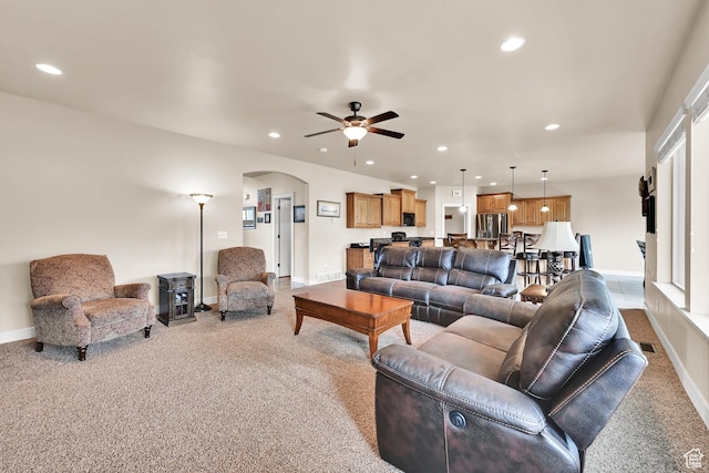 3182 N 1350 W, Pleasant View, UT 84414 - living area with carpet flooring, arched walkways, a ceiling fan, and recessed lighting