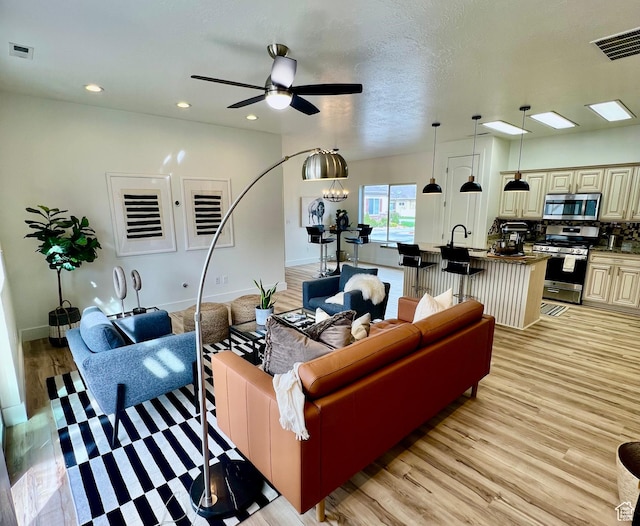 3659 S Wooded Park Ct, West Valley City, UT 84120 - living area featuring light wood-style floors, ceiling fan, recessed lighting, and baseboards