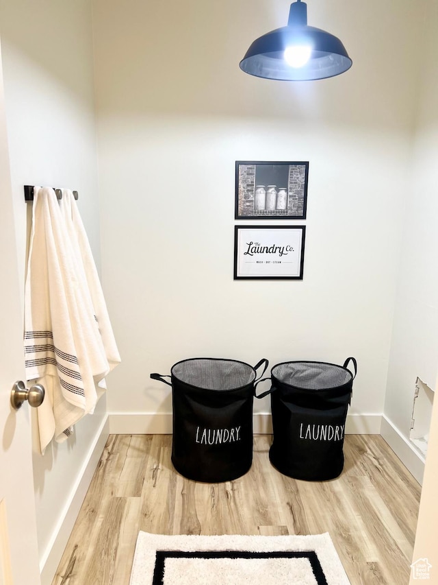 details with baseboards and wood finished floors
