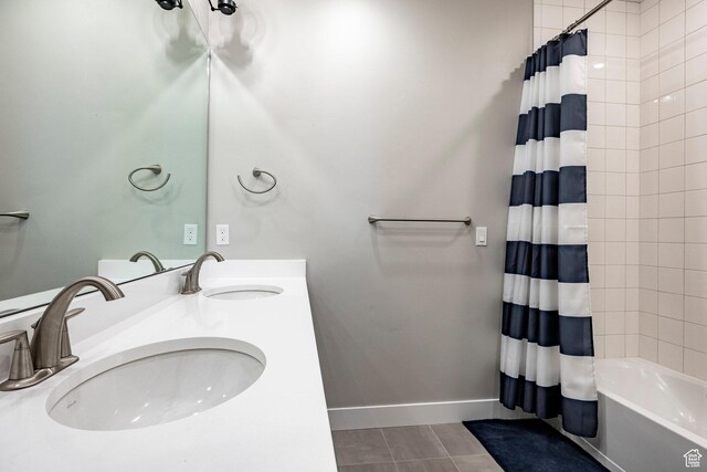 14902 S Fawley Ln, Herriman, UT 84096 - bathroom with a sink, baseboards, shower / bathtub combination with curtain, and double vanity