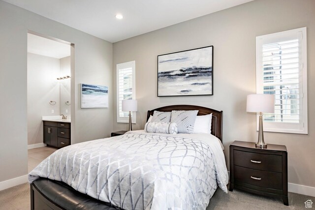 14902 S Fawley Ln, Herriman, UT 84096 - bedroom with baseboards, multiple windows, and light carpet
