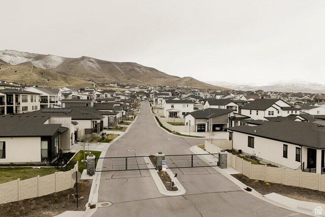 14902 S Fawley Ln, Herriman, UT 84096 - view of street with a residential view, a mountain view, and a gated entry