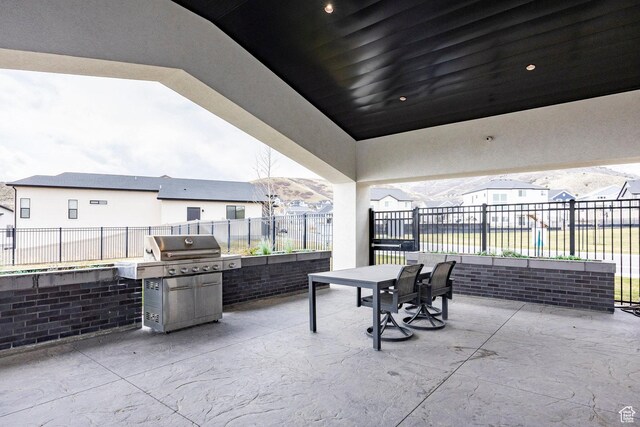 14902 S Fawley Ln, Herriman, UT 84096 - view of patio with fence, a residential view, outdoor dining area, and a grill