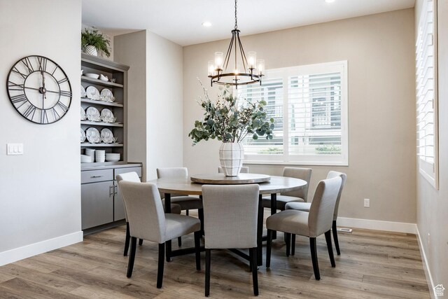 14902 S Fawley Ln, Herriman, UT 84096 - dining area featuring baseboards, recessed lighting, light wood-style flooring, and a notable chandelier