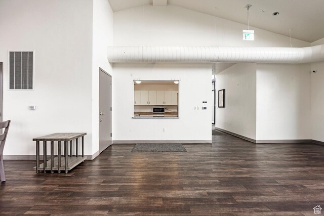 14902 S Fawley Ln, Herriman, UT 84096 - unfurnished living room featuring high vaulted ceiling, visible vents, baseboards, and dark wood-type flooring