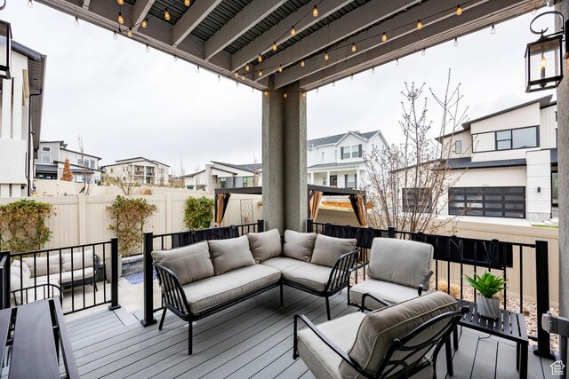 14902 S Fawley Ln, Herriman, UT 84096 - wooden terrace featuring an outdoor living space, a residential view, and a fenced backyard