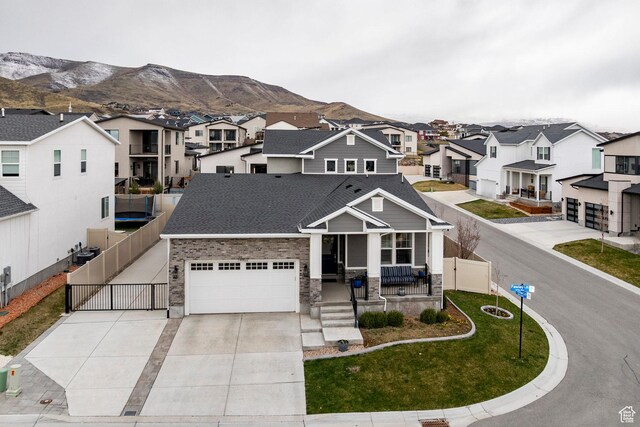 14902 S Fawley Ln, Herriman, UT 84096 - traditional-style home with a porch, a gate, a mountain view, and a residential view