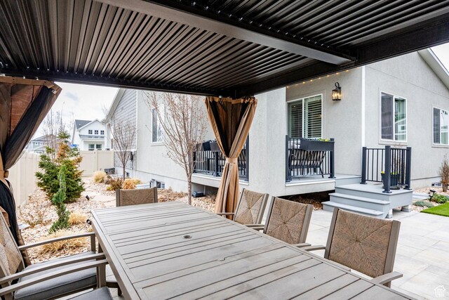 14902 S Fawley Ln, Herriman, UT 84096 - wooden terrace featuring a patio, fence, and outdoor dining space