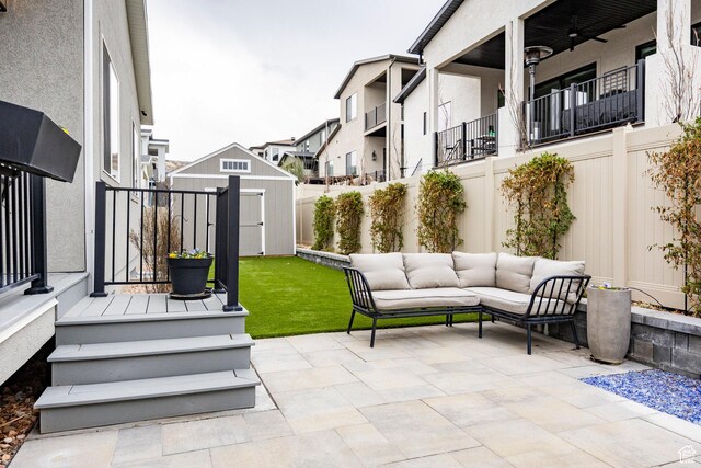 14902 S Fawley Ln, Herriman, UT 84096 - view of patio / terrace featuring a storage shed, an outbuilding, and a fenced backyard
