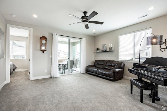 14902 S Fawley Ln, Herriman, UT 84096 - carpeted living area featuring ceiling fan, visible vents, and a wealth of natural light