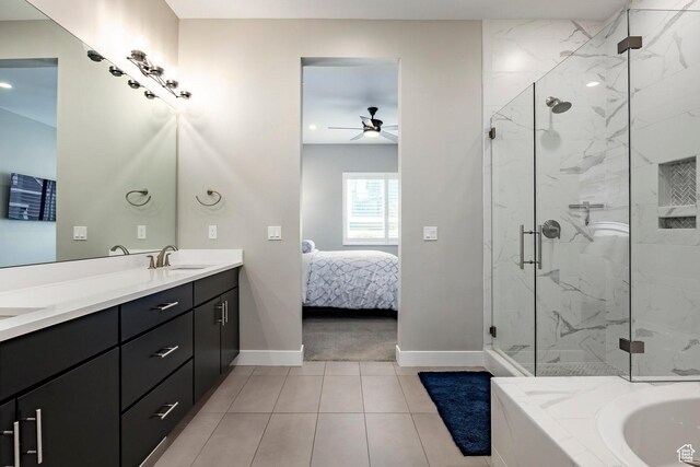 14902 S Fawley Ln, Herriman, UT 84096 - ensuite bathroom with ceiling fan, baseboards, tile patterned floors, connected bathroom, and a marble finish shower