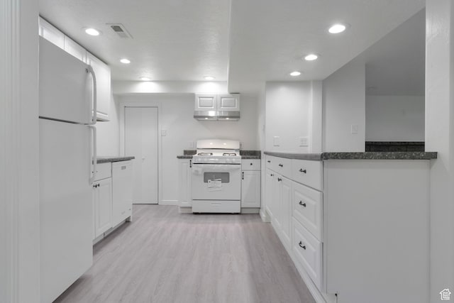 kitchen with white appliances, recessed lighting, under cabinet range hood, white cabinetry, and light wood-style floors