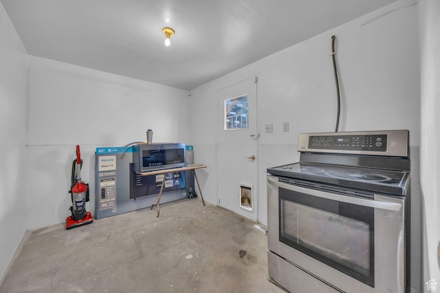 kitchen featuring appliances with stainless steel finishes and concrete flooring