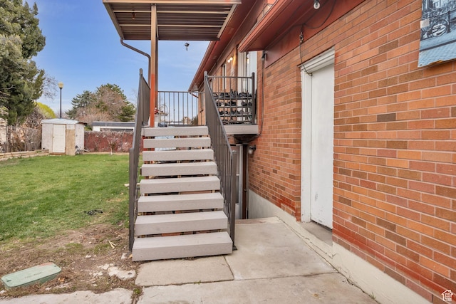 exterior space featuring an outdoor structure, a shed, and stairs