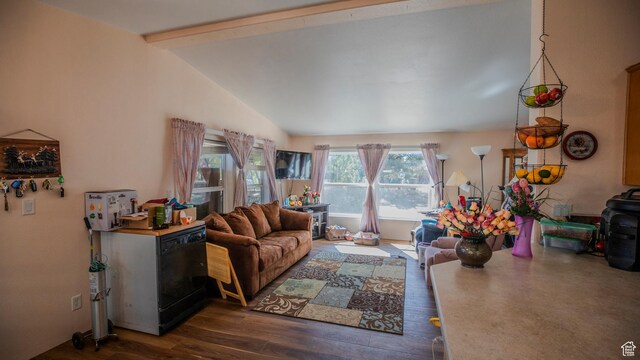 living room featuring dark wood-style floors and vaulted ceiling with beams
