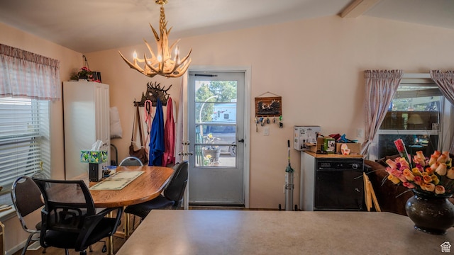 dining space with lofted ceiling with beams and a notable chandelier
