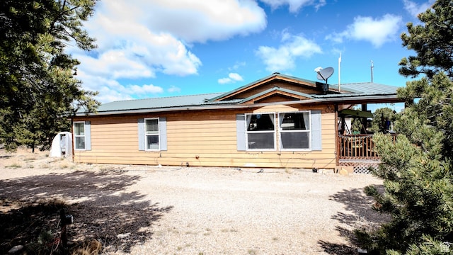 view of property exterior featuring metal roof