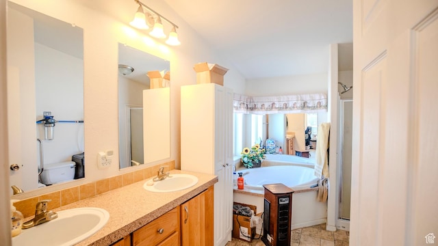 full bathroom featuring double vanity, a sink, a stall shower, and a bath