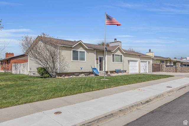 ranch-style house featuring fence, a chimney, a garage, a front yard, and driveway