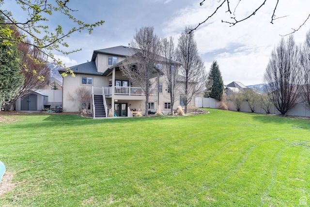 1255 W 3300 N, Pleasant View, UT 84414 - back of house featuring a yard, an outbuilding, stairway, and a storage shed