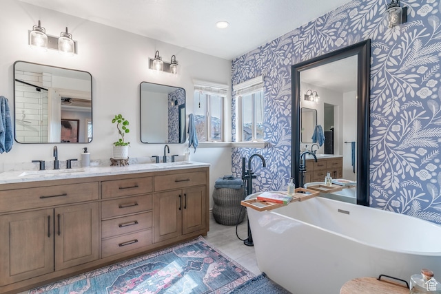 1255 W 3300 N, Pleasant View, UT 84414 - bathroom featuring double vanity, a sink, a freestanding bath, and wallpapered walls