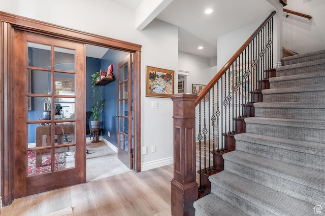 1255 W 3300 N, Pleasant View, UT 84414 - stairway featuring beamed ceiling, baseboards, wood finished floors, recessed lighting, and french doors