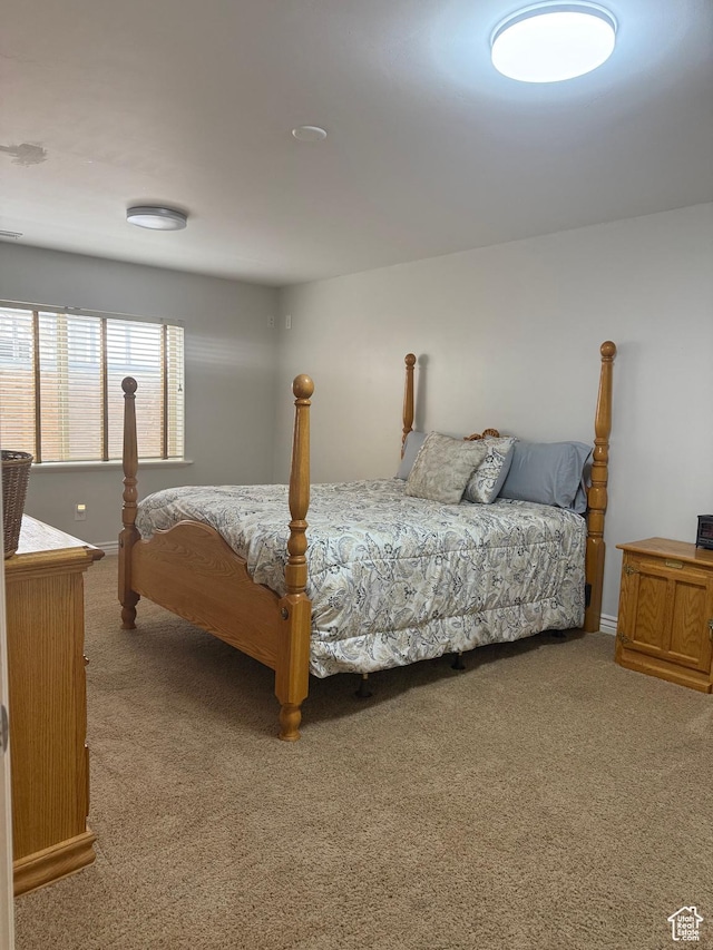carpeted bedroom with baseboards